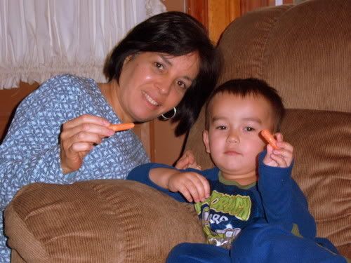 Nana and Caleb pretending with Carrots