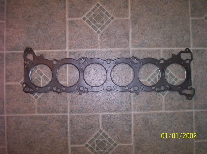 http://i139.photobucket.com/albums/q292/Sarkastik6969/Cometic12mmHeadGasket.jpg